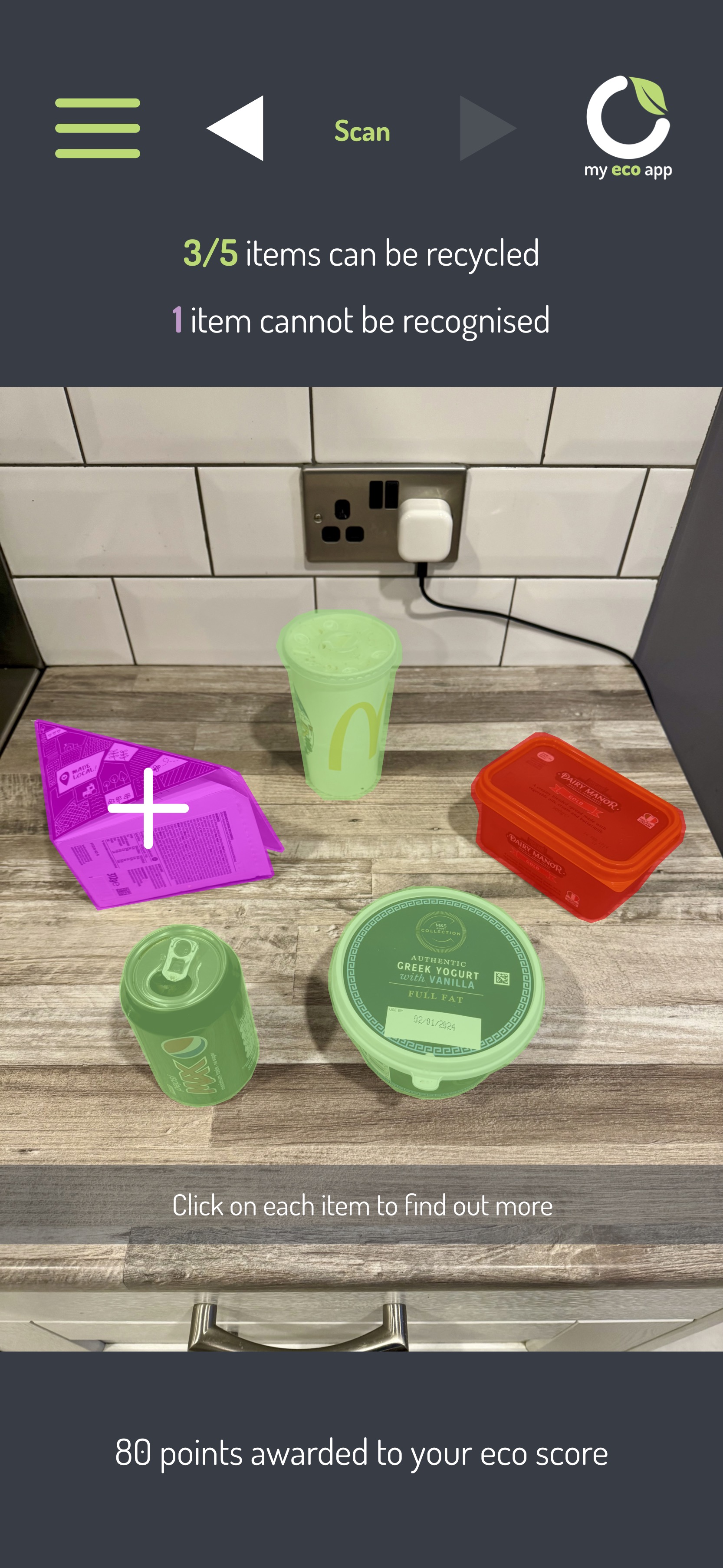 The myecoapp screen recognising household recycling items on a kitchen worktop